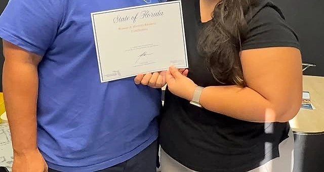 Jenniffer and her partner at the Evibes shop